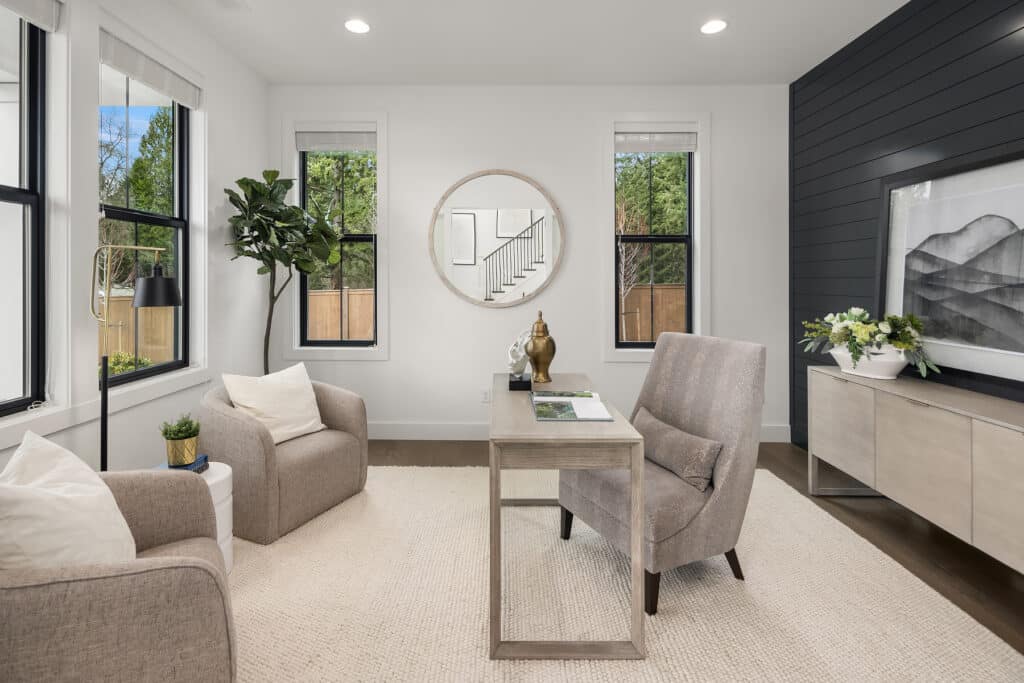 Modern home office with large window and desk