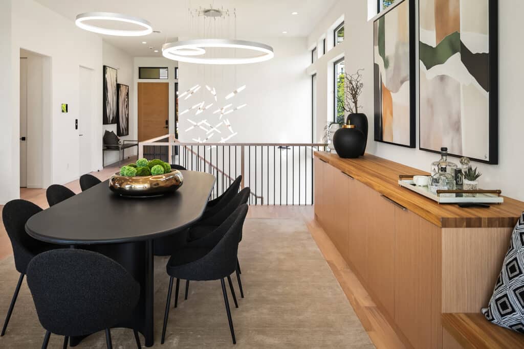 Modern dining room with black table and artwork