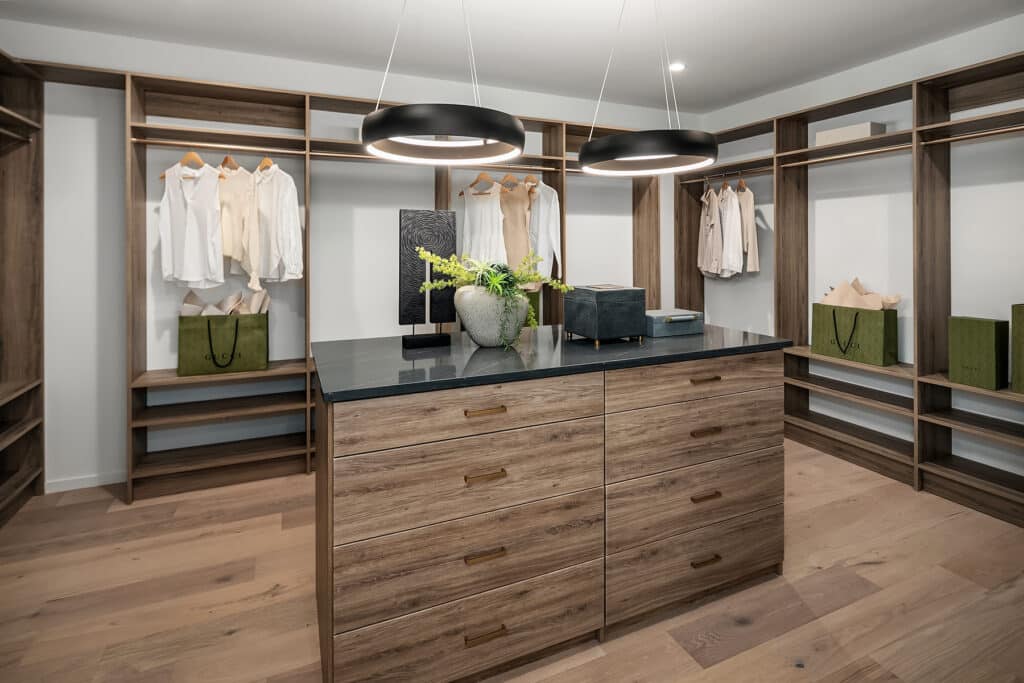 Modern walk-in closet with wooden shelves